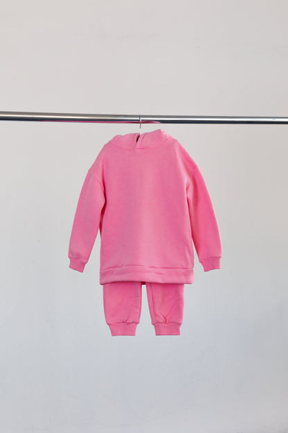 Pink jogger set hanging