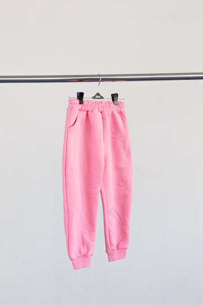 Pink jogger bottoms hanging